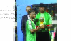 •PRESIDENT Edgar Lungu hands over the AFCON trophy to the Zambian skipper Solomon Sakala as CAF president Issa Hayatou looks on. Picture by JEAN MANDELA