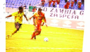 • ZESCO United striker Idriss Mbombo (right) goes for goal under pressure from Le Messager Ngozi defender during yesterday’s CAF Confederation Cup match at Levy Mwanawasa Stadium in Ndola.