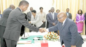 President Edgar Chagwa Lungu (left) congratulates  Zambia’s High Commissioner to Malawi Dr John Phiri (right) during the swearing in ceremony at State House in Lusaka yesterday. Picture By SALIM HENRY/STATE HOUSE