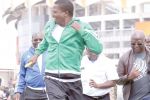 • CATCH me if you can: President Edgar Lungu sprints in a 100 metre relay at the Olympic Youth Development Centre in Lusaka yesterday during the launch of Health Week.  Picture by EDDIE MWANALEZA/STATE HOUSE 