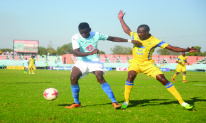 • KABWE Warriors’ Clement Mwape keeps Napsa Stars’ Fred Musinde at arm’s length as he shields the ball during a Week-17 Premier division fixture at Nkoloma stadium that Napsa won 1-0 to go eight points clear on top of the table. Picture BY GODFREY DUBE
