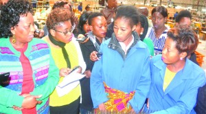• MINISTER of Labour Joyce Simukoko talks to Eve’s Hair Production workers during the inspection of the Eve's factory in Lusaka yesterday. Picture by JOSEPHENE NSULULU/ZANIS