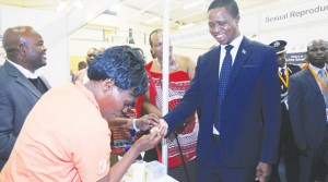 • PRESIDENT Edgar Lungu (right) undergoes HIV testing as Swaziland’s King Mswati III (centre) looks on during the tour of stands at the 49th Swaziland International Trade Fair at Mavuso Exhibition and Trade Centre in Manzini, Swaziland  on Saturday. Picture By SALIM HENRY/STATE HOUSE
