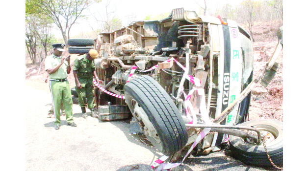 • Northern Province Police Commissioner Richard Mweene at the accident Scene along the Maba-Mpulungu road.The Isuzu truck Reg No ACK 5871 was carrying more than 60 people and careered off the road after losing the brakes. Several other people are admintted in Mbala and Mpulungu hospitals with critical conditions. Picture by Mary Bwembya (ZANIS)