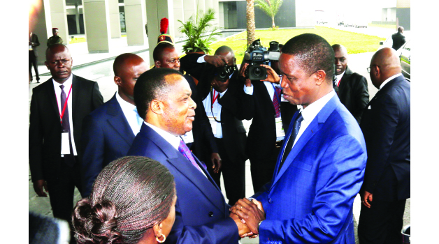 • PRESIDENT Edgar Lungu (right) being welcomed by his Congo Brazzaville counterpart Denis Sassou Nguesso at the Presidential Hall in Brazzaville yesterday. Picture by SALIM HENRY/STATE HOUSE