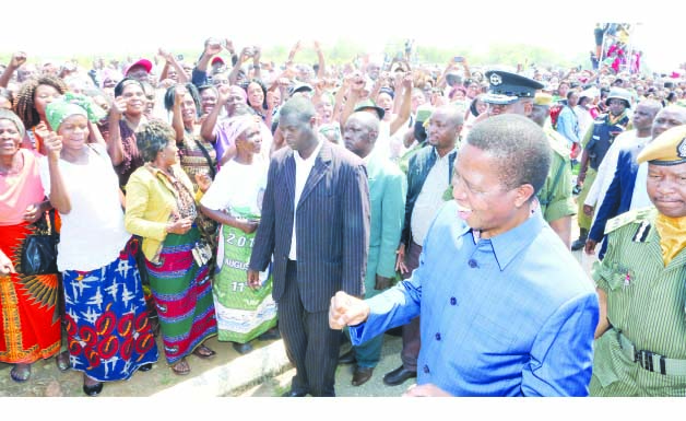 • Man of the People: President Edgar Lungu greets supporters at Simon Mwansa Kapwepwe International airport in Ndola yesterday.Picture by Eddie Mwanaleza