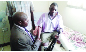 • SOUTHERN Province Minister Edify Hamukale (left) consoles Senior Chief Mweemba (right) from his hospital bed at Livingstone Central Hospital where he is receiving treatment. This follows the burning of his palace by unknown people, which led to the death of his grandson. Picture by BRIAN HATYOKA
